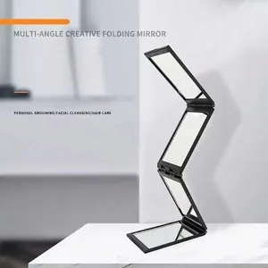 Portable 4-way folding makeup mirror with multiple viewing angles in black frame