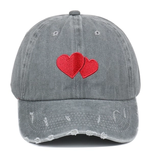 Distressed grey baseball cap with red heart embroidery and retro washed finish
