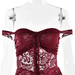 Detail of burgundy lace off-the-shoulder dress with intricate lace and tie-up front design