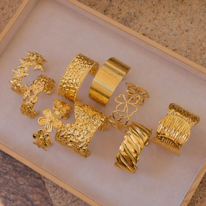 Modern 18K gold-plated stainless steel cuff bracelets with wave and floral textures
