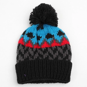 Detailed close-up of geometric diamond pattern and warm knit texture on beanie
