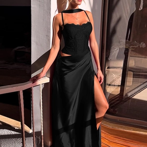 Detailed shot of black lace bodice stitching and side slit satin dress on a woman