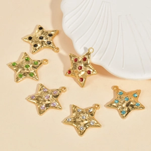 Detailed view of colorful rhinestone star pendants in gold plating for DIY jewelry making