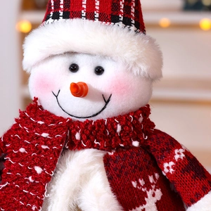 Christmas snowman doll with red checkered hat and reindeer knit shawl decoration