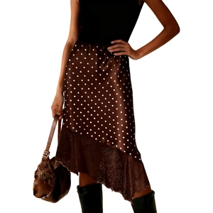 Detail of a brown polka dot midi skirt with delicate lace trim hem and sleek satin finish