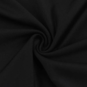 Macro shot of high-density black knit fabric showing smooth texture and supple drape