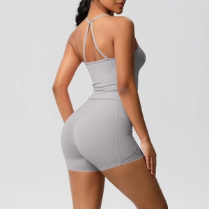 Macro detail of grey ribbed yoga set showing side pockets and seamless fabric texture