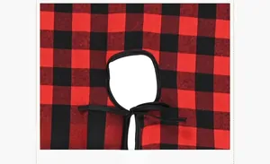 Detail of red and black buffalo plaid Christmas tree skirt with fabric ties
