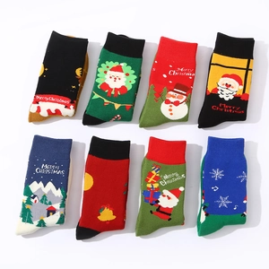 Set of 8 thick Christmas terry socks with Santa and reindeer patterns on white background