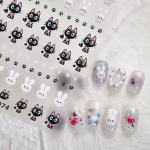 Detail of cartoon black cat and white rabbit nail stickers with application demo