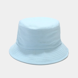 Detailed texture of a sky blue cotton bucket hat with sun protection for outdoor use