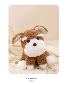 Close-up of fluffy Schnauzer plush toy with soft white beard on a beige knit blanket