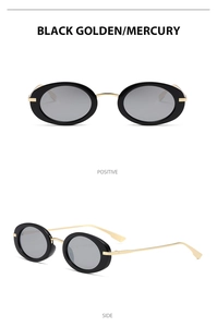 Detail view of oval Y2K sunglasses with black-gold metal frames and mercury lenses