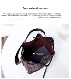 Top view of the spacious main compartment in a brown geometric bucket bag with drawstring