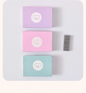 Macro shot of 10# mini staples in colorful purple, pink, and cyan boxes for mini staplers