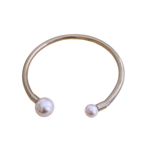 Minimalist gold metal open choker with elegant double pearls on white background