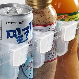 Adjustable white divider clips for refrigerator side door storage and organization