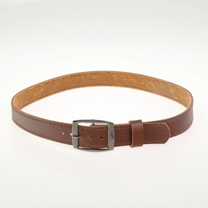 Detailed close-up of brown leather strap with metallic buckle and neat stitching