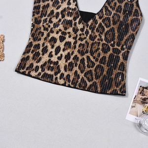 Close-up of leopard print sequin crop top with shimmering gold and black fabric detail
