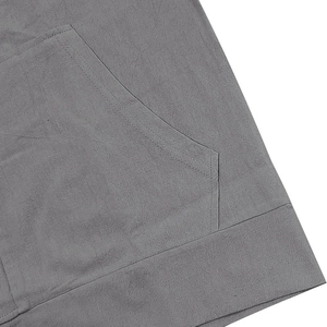 Detail of the gray linen shirt kangaroo pocket and texture showing durable double stitching