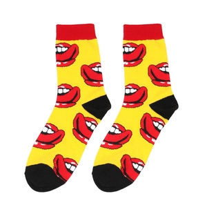 Close-up of yellow cotton socks with red lip pattern and black reinforced toe and heel