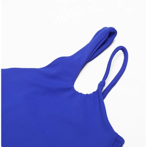 Detailed view of royal blue yoga bra showing unique dual shoulder strap design on fabric