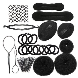 Complete black hair styling tool set with bun makers and hair needles on white background