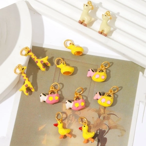 Golden DIY cartoon animal pendants featuring giraffes and ducks for jewelry making