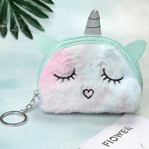 Close-up of plush unicorn coin purse with soft tie-dye gradient and metal keychain