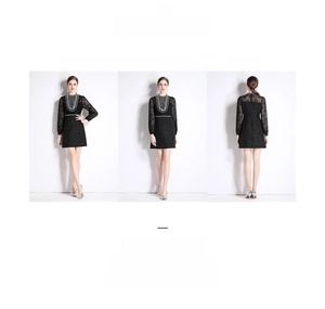 Détail d'une robe en tweed noir avec broderies de perles et manches en dentelle raffinée