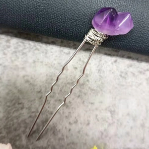 Macro detail of natural amethyst quartz cluster on silver wire-wrapped U-shaped hair pin
