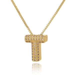 Close-up of golden letter T pendant with sparkling cubic zirconia on a box chain necklace