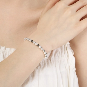 Detail of baroque pearl and engraved silver beads on an elegant women's bracelet