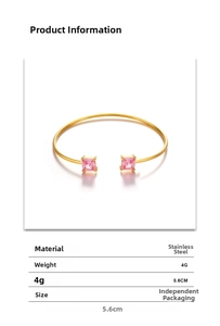 Detail view of a 4g gold stainless steel open bangle with pink square zircon stones