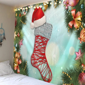 Detailed close-up of Christmas stocking tapestry with bells and pine branches on wall