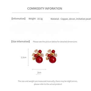 Size chart showing gold plated floral earrings with red pearls and zircon details