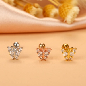 Detailed view of sea horse screw back earrings in gold, silver and rose gold with zircons