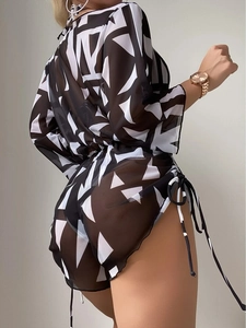Detail of sheer black mesh beach cover-up set with white geometric triangle patterns