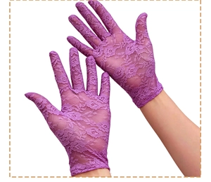 Close-up of purple lace gloves with floral hollow patterns and elastic mesh texture
