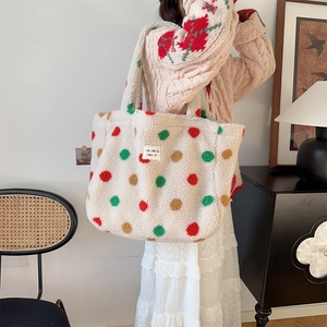 Detail of plush off-white tote bag with colorful polka dots and lamb wool texture