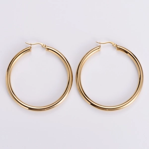 Detailed close-up of 18k gold plated hollow hoop earrings in polished stainless steel