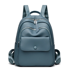 Blue-grey soft PU leather backpack with multiple zip pockets and silver hardware