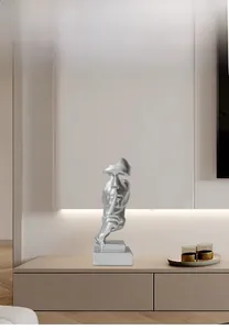 Macro detail of silver silence is gold sculpture with matte finish for home office decor