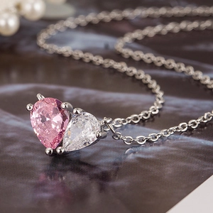Elegant silver necklace with dual pear-cut pink and white zircon heart pendants