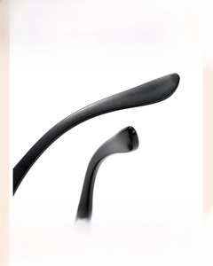 Detail showing the curved anti-slip temples of black vintage kids square sunglasses