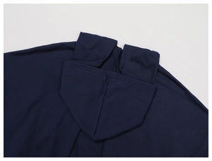Detail of navy blue hoodie featuring high-density knit fabric and shoulder seam craftsmanship