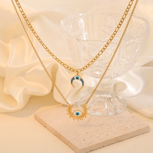 Gold double layer moon and sun crescent necklace with blue evil eye enamel charms