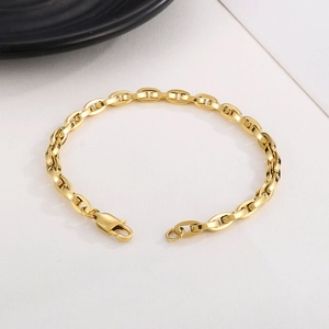 Detail of 5mm gold stainless steel oval link chain bracelet with a sturdy lobster clasp