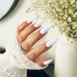 Elegant long almond white glossy press-on nails with luxury diamond ring accent