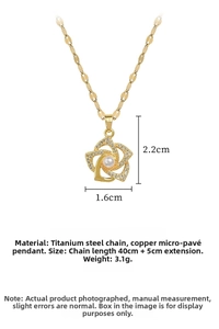 Macro detail of gold flower pendant with micro-paved zircons and center pearl